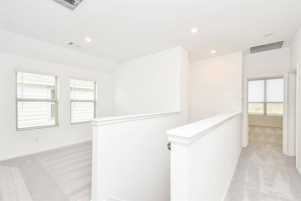 Loft can be used as study/office space or play area. Virtually staged photo