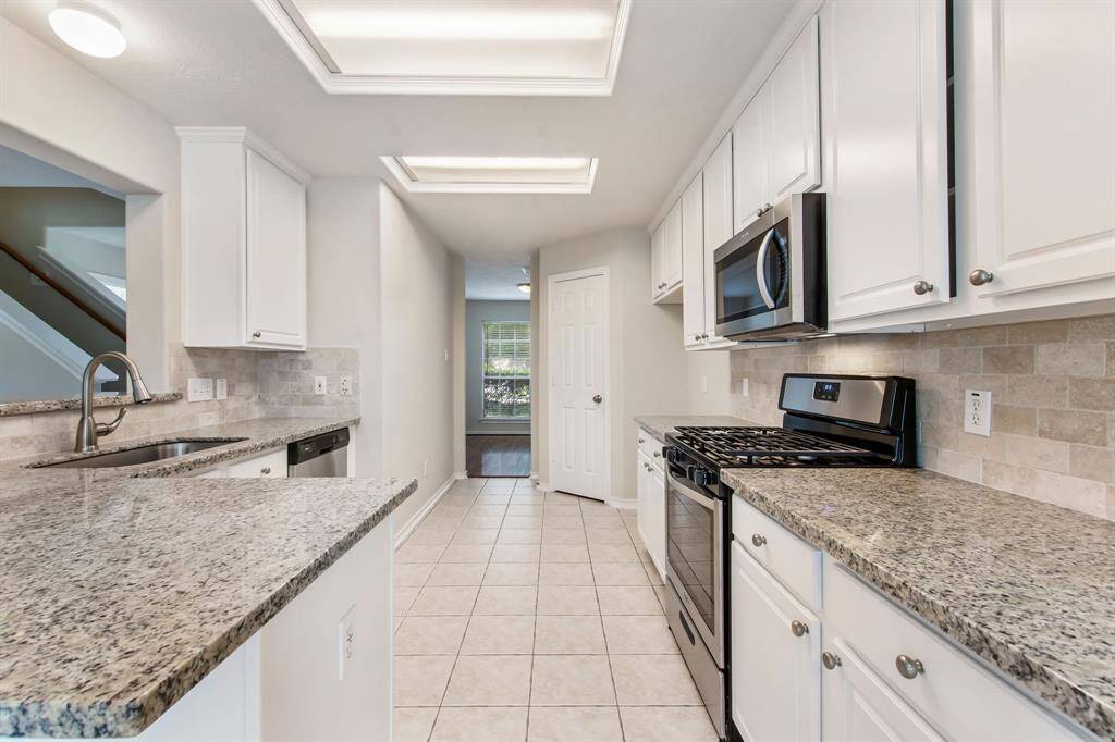 Other notable features include single handle faucet, brushed nickelhardware and a walk-in pantry with built-in shelving.
