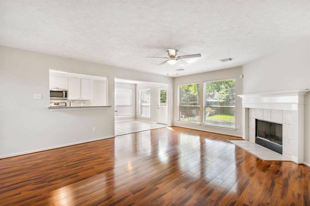 A view of the den open to the kitchen and breakfast room.