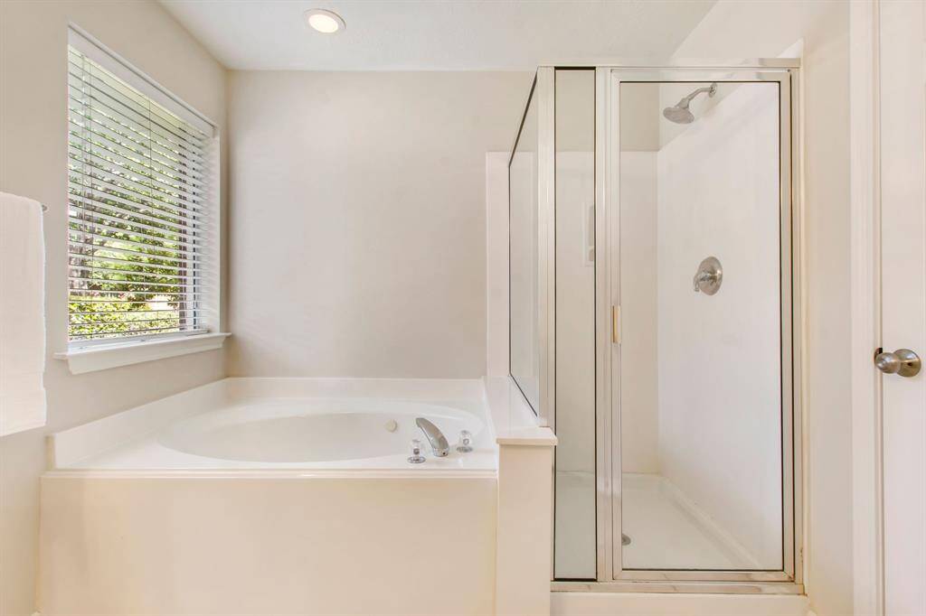 Relax in the jetted tub or walk in shower with glass enclosure.