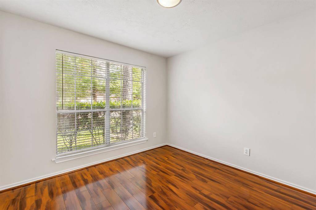 The formal dining room or an optional office space features rich laminate wood flooring.