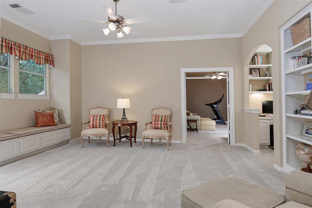 Large game room with plenty of space to play. Added window seat and built-in shelves are great features.