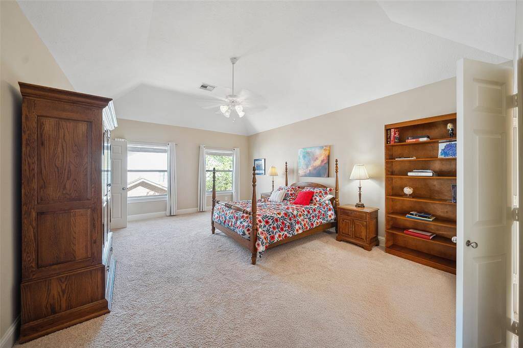 The owner's retreat features a vaulted ceiling, large walk-in closet, and en-suite bathroom.