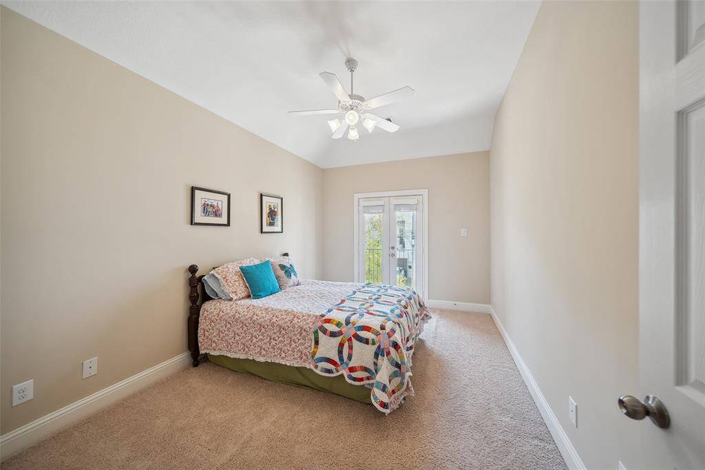 On the opposite end of the hall are the two guest bedrooms with private access to the balcony. Both rooms easily accommodate queen size furniture sets and have walk-in closets.