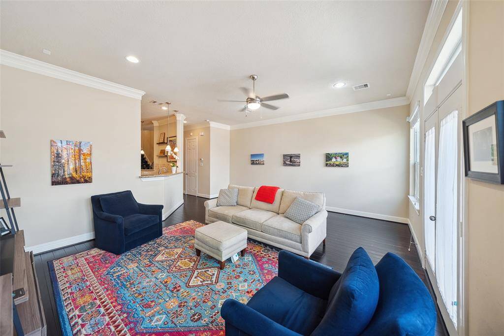 The living room is a bridge between the kitchen and the backyard, making this home great for holiday get togethers.