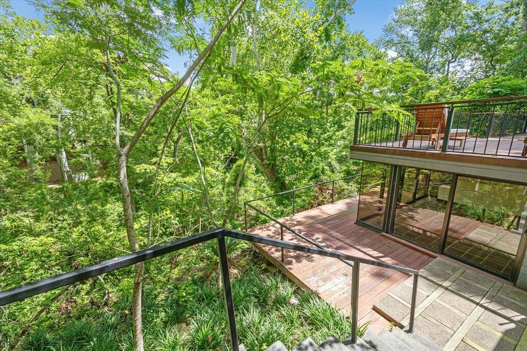 The surrounding landscape is a tapestry of greenery, with towering trees, native plants, and wildlife enhancing the scenic beauty of the bayou. Whether you're relaxing indoors or spending time outdoors, the captivating views of the bayou and its natural surroundings provide a constant source of inspiration and serenity.