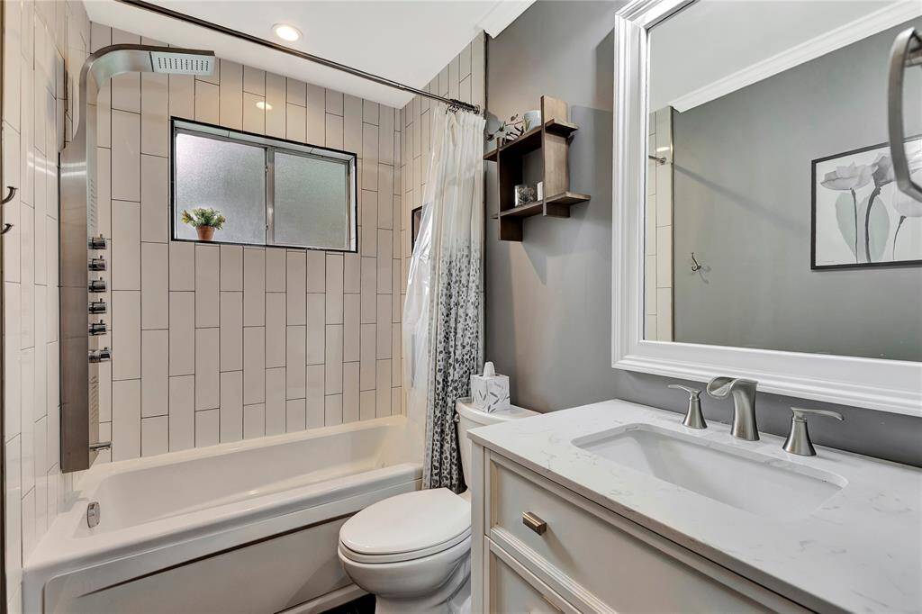 Hall Bathroom with heated, jetted tub.
