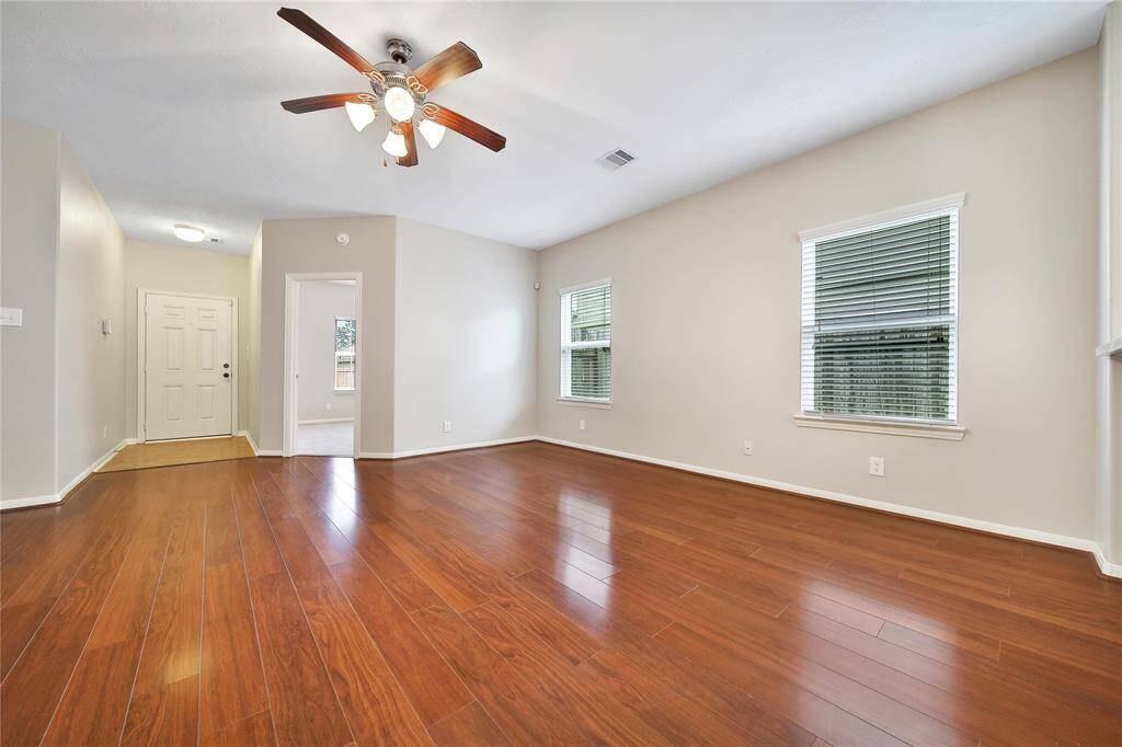 Large living area with high ceilings.