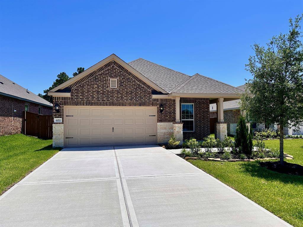 Imagine pulling into the driveway of this beautiful one-story home featuring a modern brick and stone design.