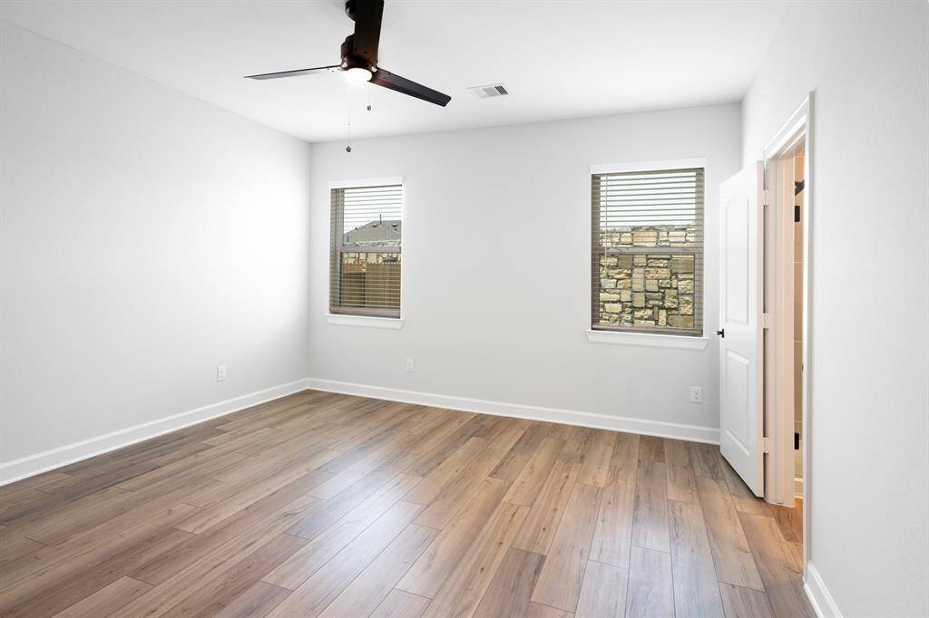 The master bedroom is filled with natural light and a warm and welcoming environment.
