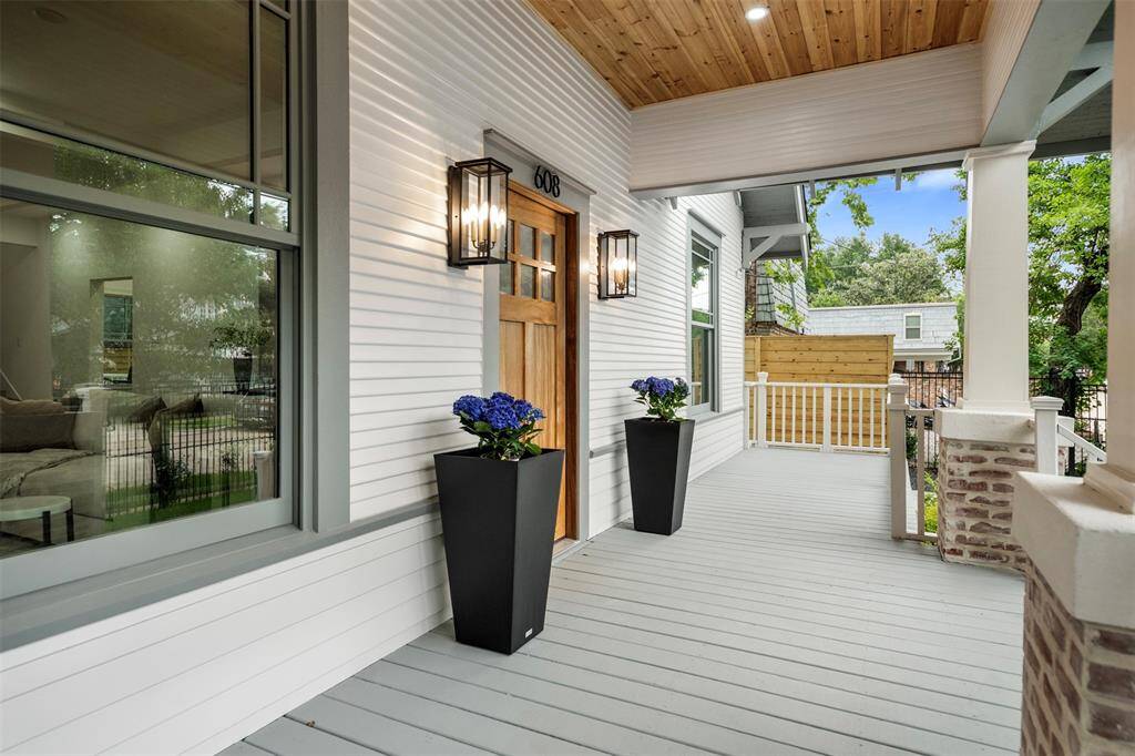 Charming front porch with enough space for seating and a porch swing.