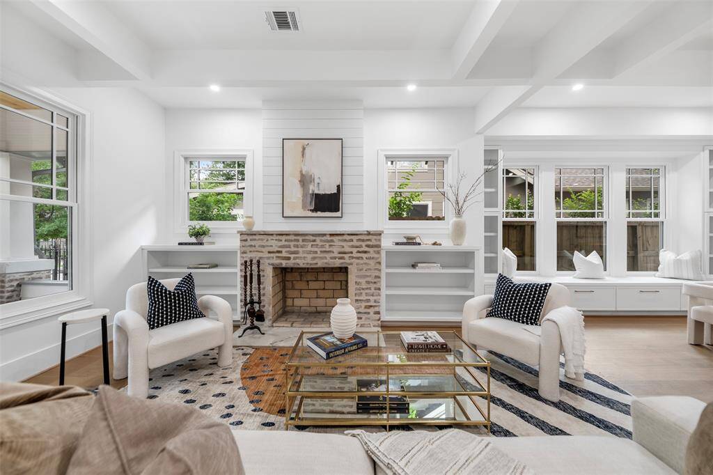 The home maintains its charm with original brick fireplace