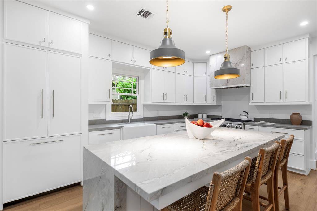 High end stainless steel appliances and panel ready fridge