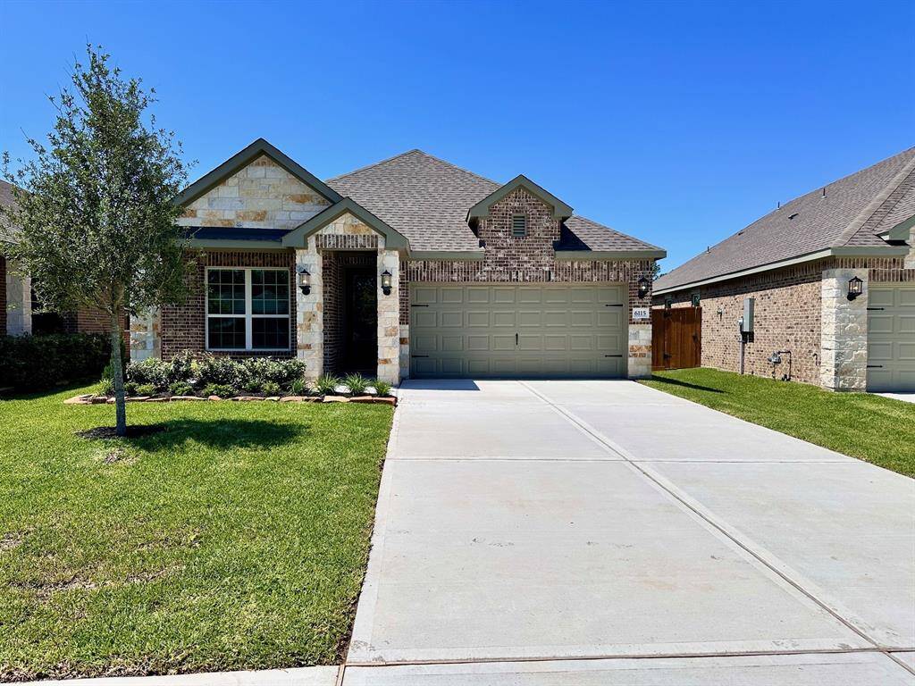 Imagine pulling into the driveway of this beautiful one-story home featuring a modern brick and stone design.