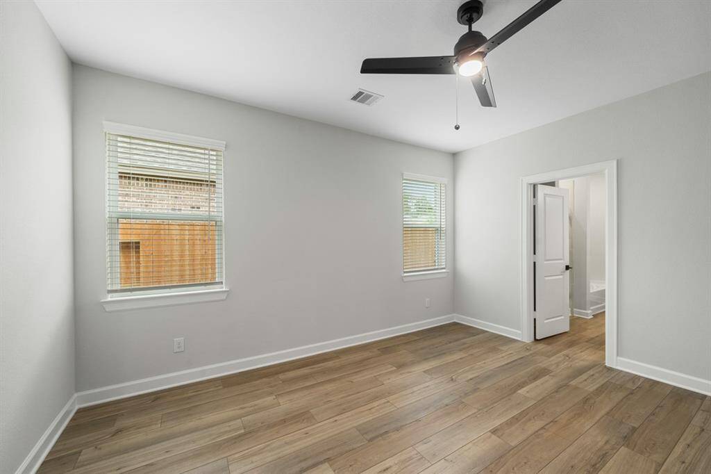 The master bedroom is filled with natural light and a warm and welcoming environment.