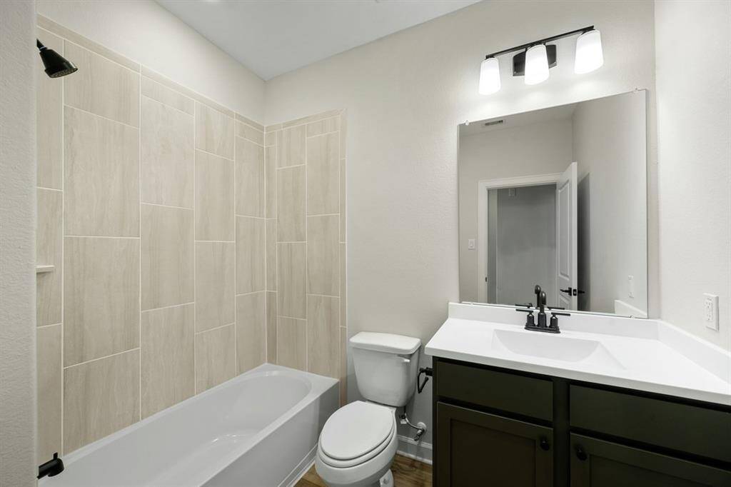 Your guests will love this beautiful, tiled shower, modern vanity and upgraded fixtures.