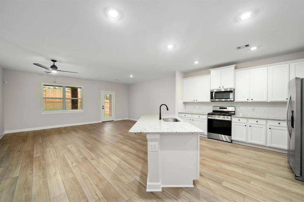 This breakfast bar will perfectly fit barstools for entertaining and socializing.