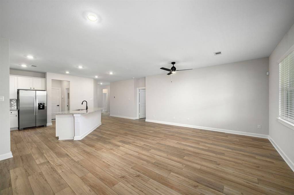 If you love an open concept kitchen and living area, you will love this space.
