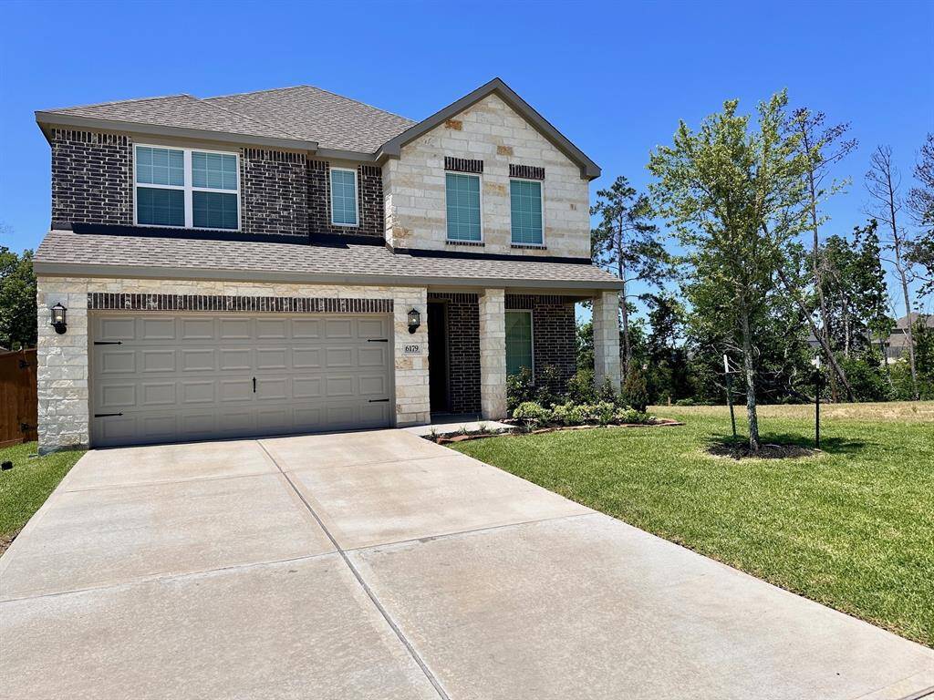 Imagine pulling into the driveway of this beautiful one-story home featuring a modern brick and stone design.