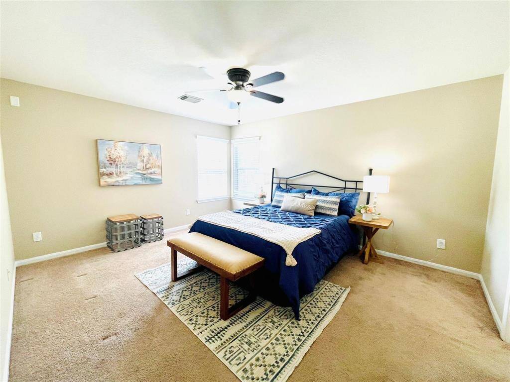 Spacious primary bedroom is onthe first floor.