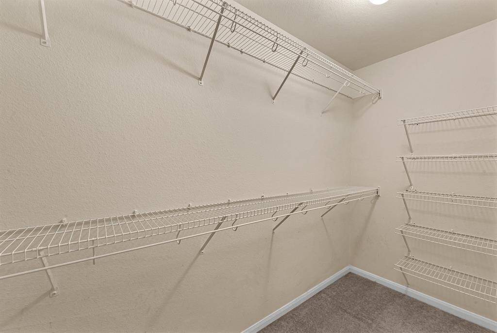 Walk in closet for the primarybedroom.