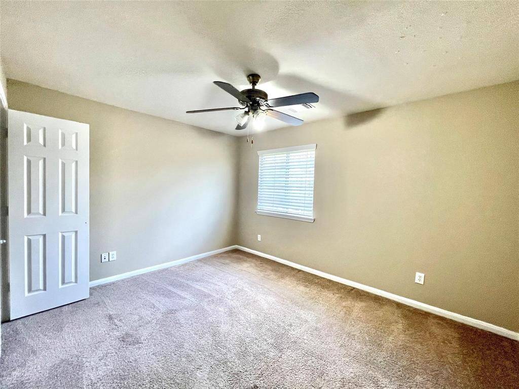 game room upstairs.Secondary Bedroom #1 with fanand large closet.
