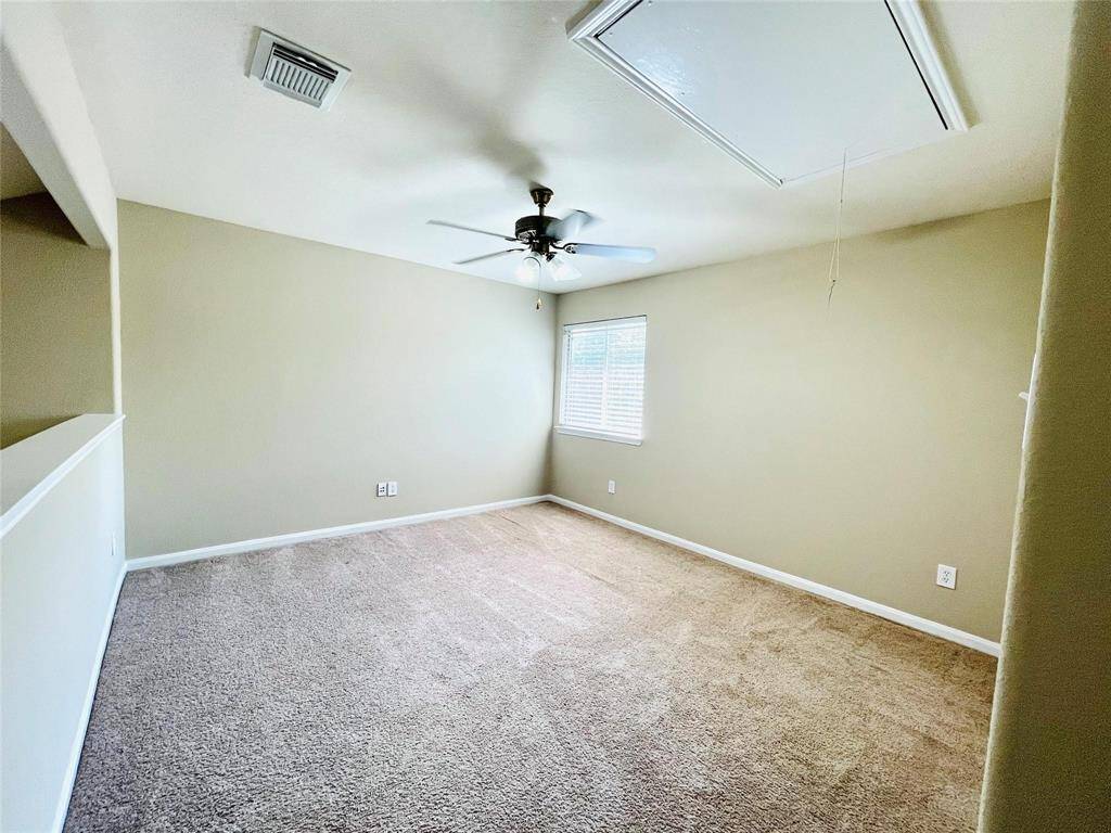 Game room/loft area upstairswith ceiling fan.