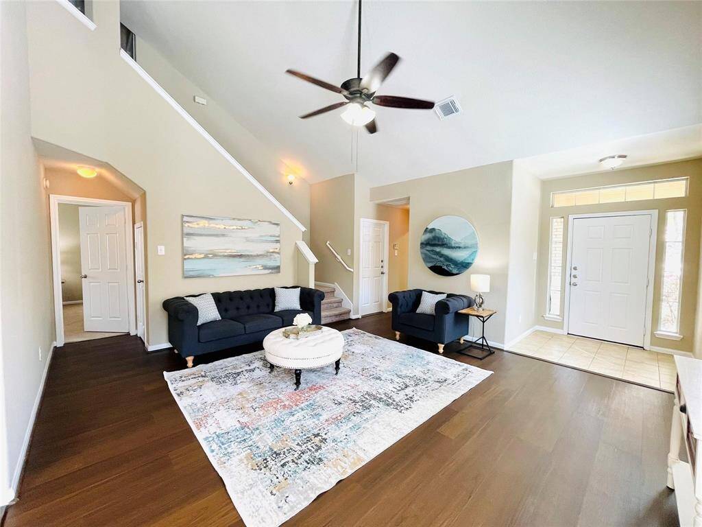 From this view, to the left is theprimary bedroom entrance and acloset under the stairway.