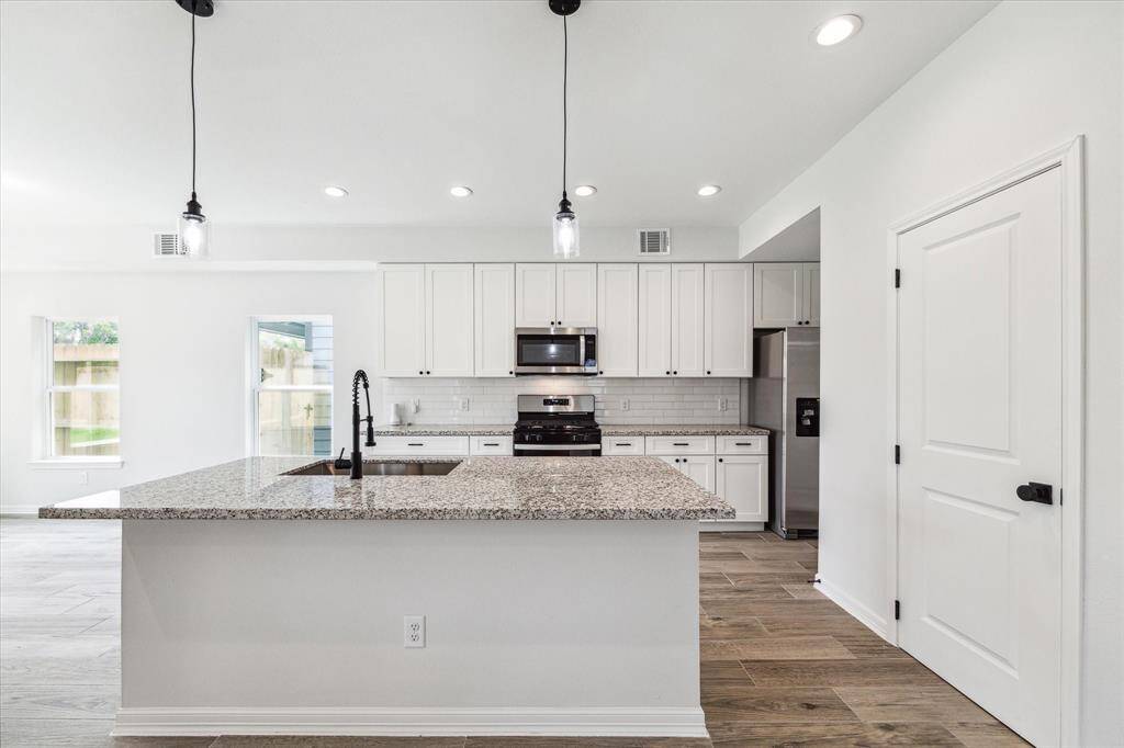 Kitchen w/Island (picture is from 2024 prior to occupancy)
