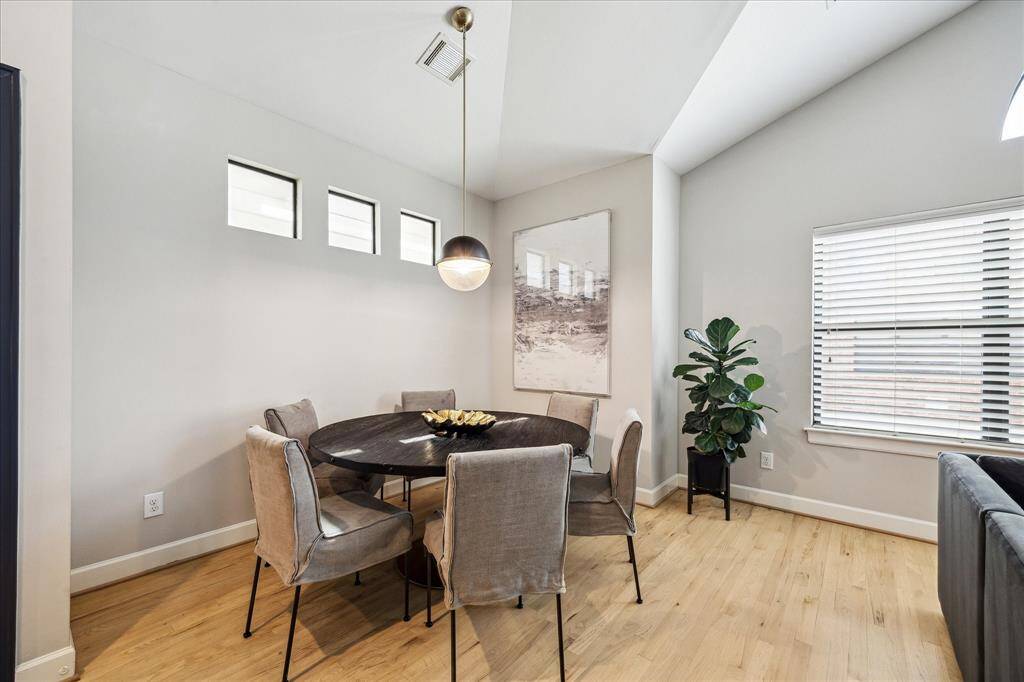 Dining area with hanging pendant light.