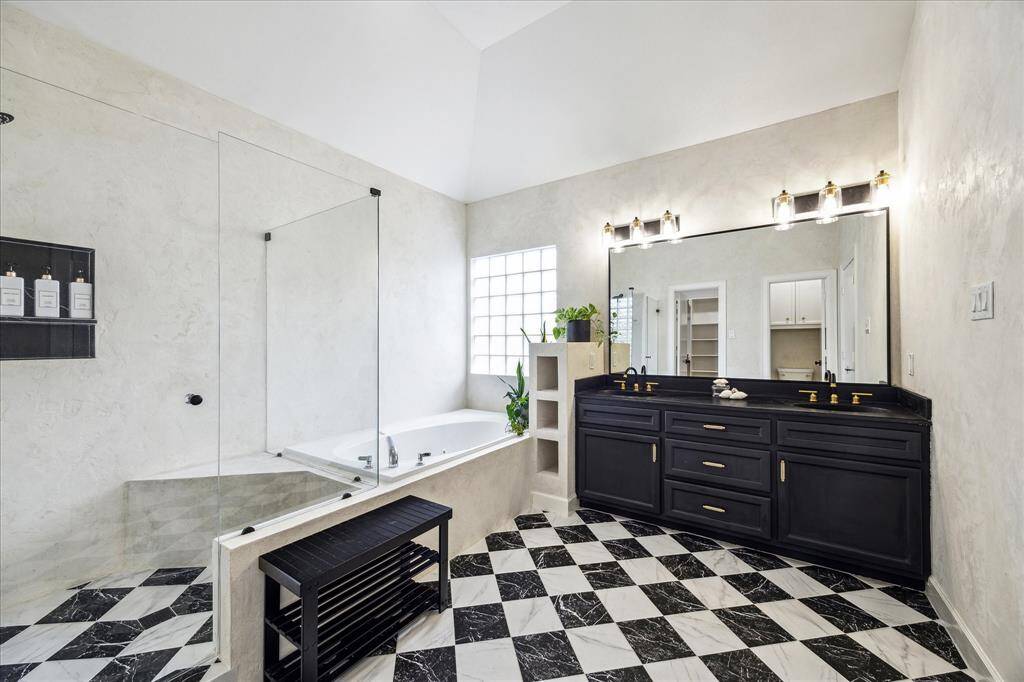 Bathroom has a lime plaster finish and micro cement finish on countertop.