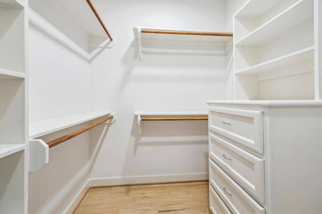 Primary bedroom walk in closet.