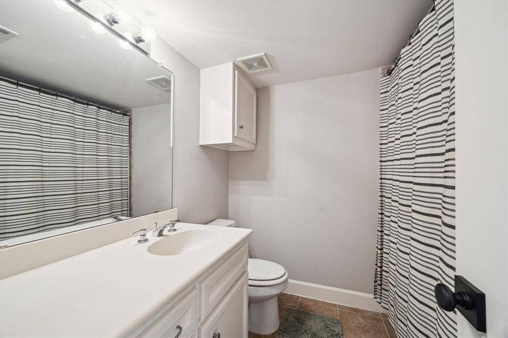 Hall bath for downstairs bedrooms.