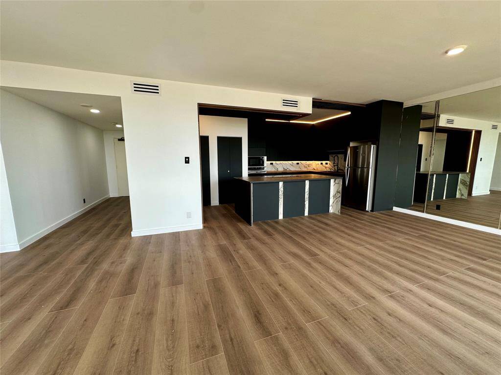 Open concept kitchen / living.