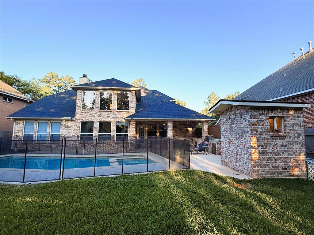 Backyard with enclosed pool and outdoor bathroom