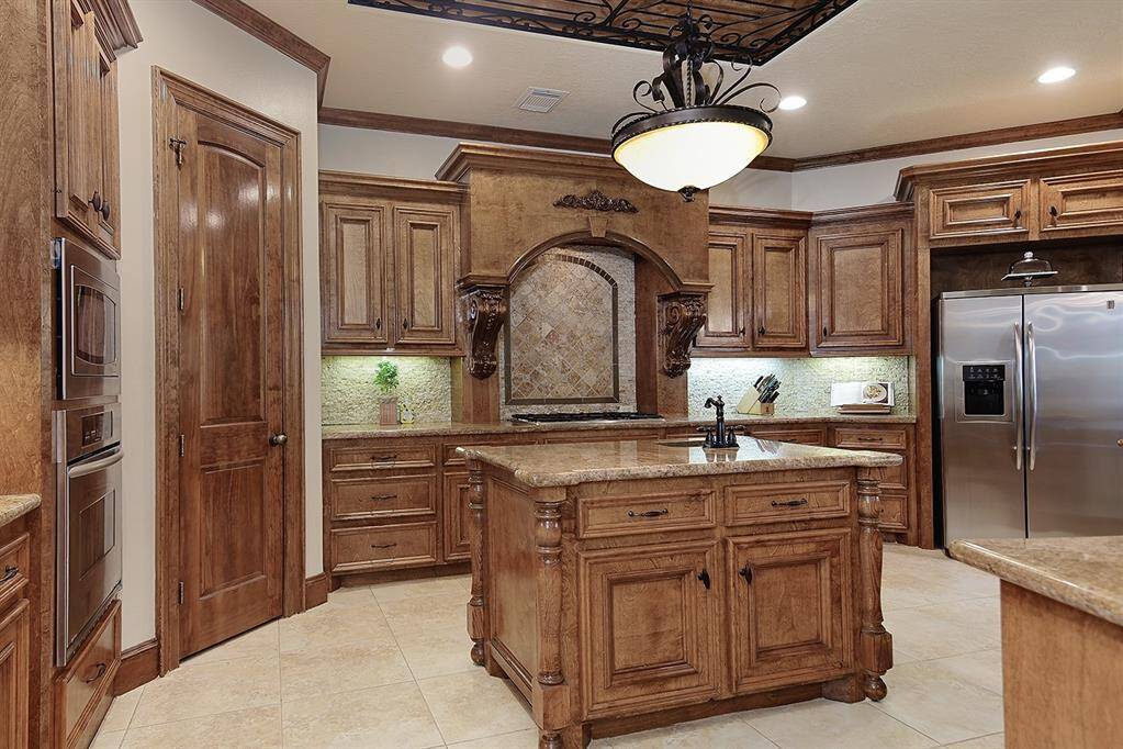 Well appointed gourmet kitchen with large preparation island with convenient prep sink.