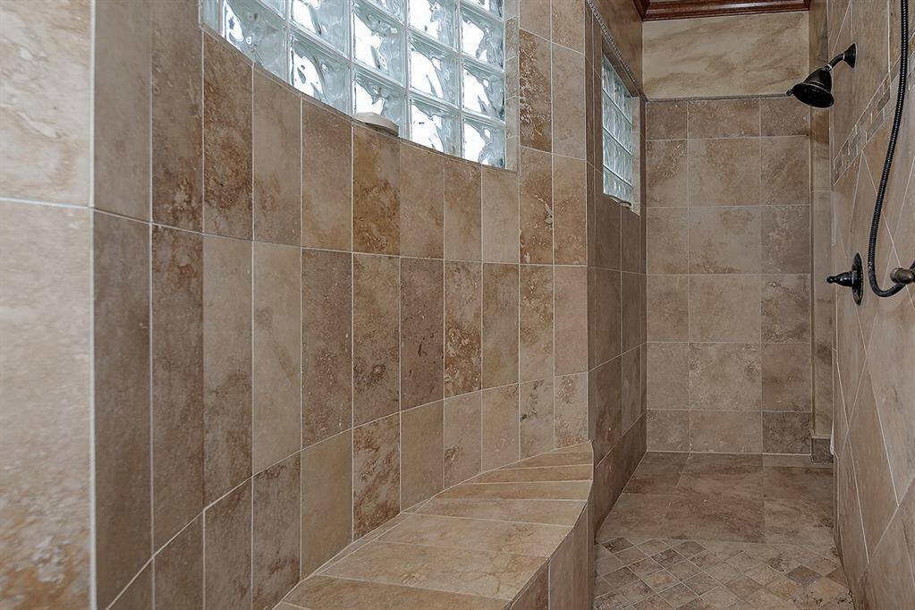 Dual entry shower with relaxing bench