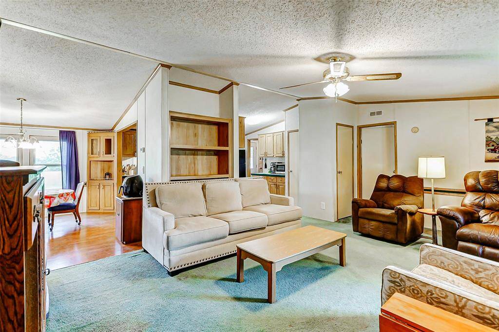 This open floor plan is complemented by plentiful natural lighting.