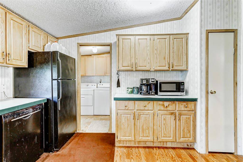 Easy breezy access to the utility room and back porch from the kitchen.