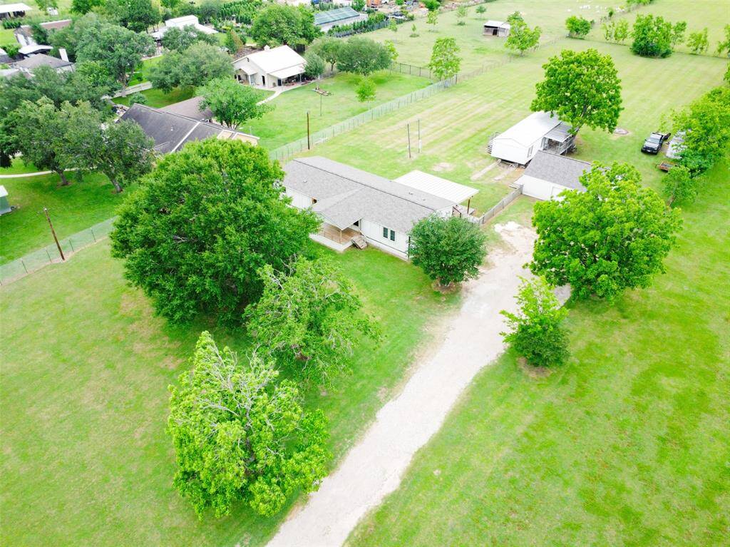 The property has a long driveway leading to the 2 residences & separate garage.