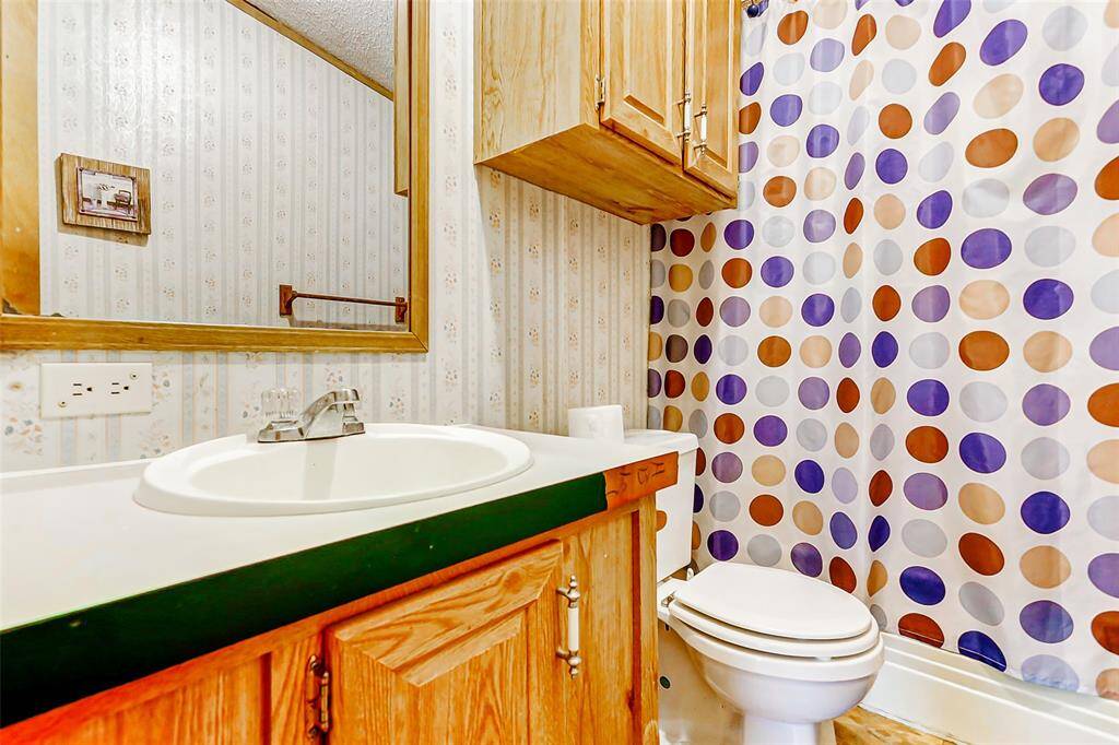Secondary bathroom with ample storage.
