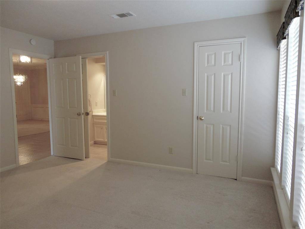 ANOTHER VIEW OF FRONT BEDROOM... & DOORWAY INTO PRIVATE BATH...