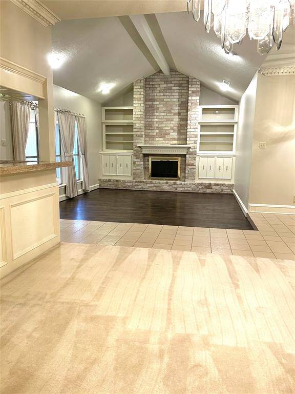 VIEW FROM DINING ROOM.. LOT'S OF TRIM WORK.. VAULTED CEILING...BEVERAGE SERVICE BAR ON LEFT FOR ENTERTAINING..
