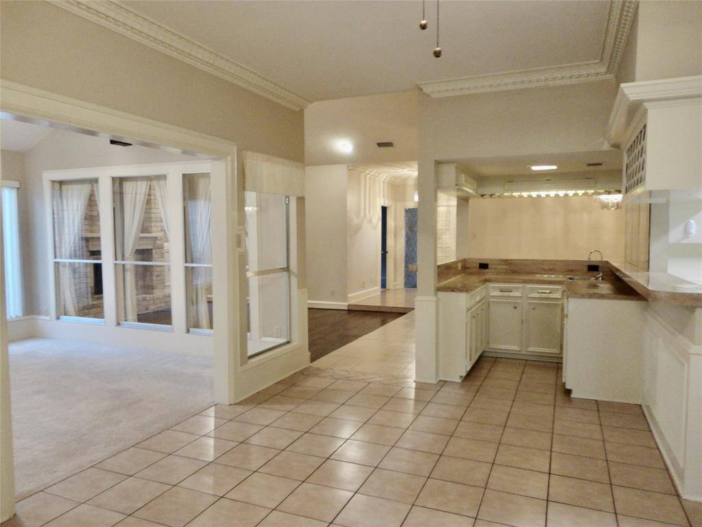 VIEW FROM OVERSIZED  BREAKFAST AREA.. SUN/GAME ROOM ON LEFT... BACK TO ENTRY FOYER... SO MUCH FLEX LIIVNG SPACE...