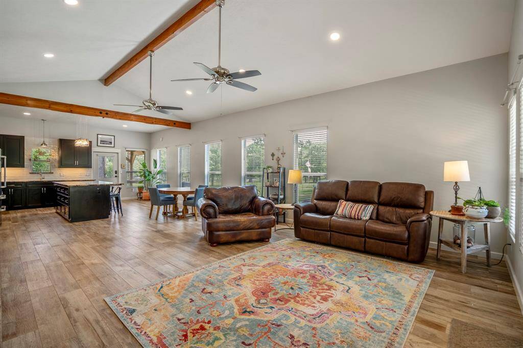 Family room seamlessly connects to a modern kitchen making this home ideal for entertaining.