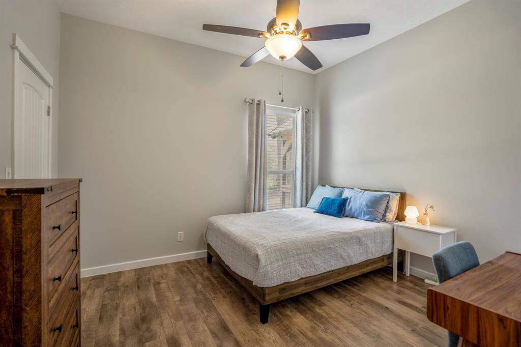 The secondary bedroom features a neutral color palette and is perfect for guests!  It offers a bright and airy atmosphere.