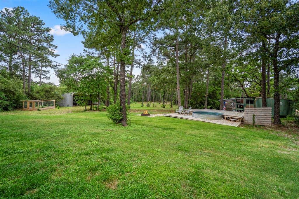 There's even a fire pit with seating and a small outbuilding, perfect for outdoor relaxation and gatherings.