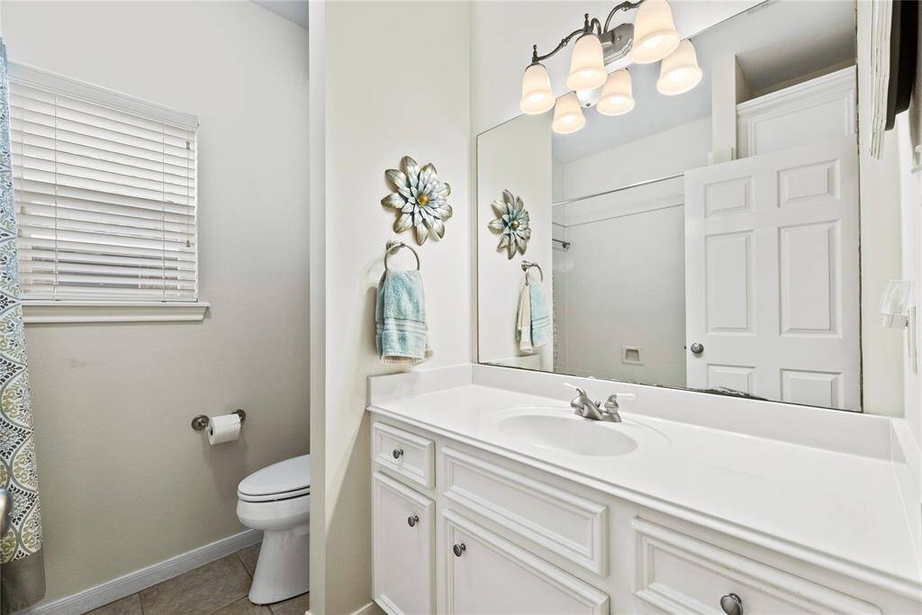 The secondary bathroom is stylishly appointed and thoughtfully designed for comfort and convenience.