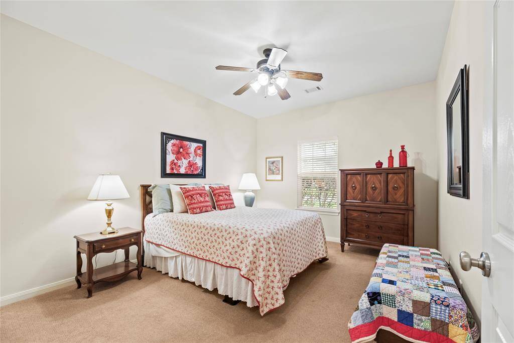 The expansive fourth bedroom offers incredible versatility—ideal as a guest suite or home office, with ample space to suit your lifestyle needs.
