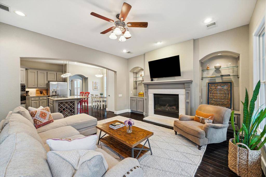 The living room opens to the kitchen, creating an ideal space for both entertaining and everyday living.